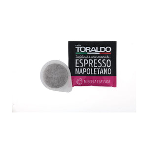 Toraldo Caffè Einzelverpackung fũr Kaffee Pads Miscela Classica, daneben das offene Kaffeepad vor weissem Hintergrund